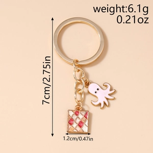 Detail view of octopus keychain dimensions with size and weight labels in golden finish