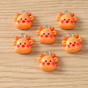 Detail view of 6-piece reindeer resin charms with silver rings for DIY jewelry making
