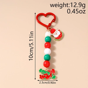Close-up of Christmas beaded keychain with Santa Claus and candy charms in red and green
