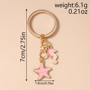 Detail view of pink enamel seahorse and starfish keychain with measurements in inches