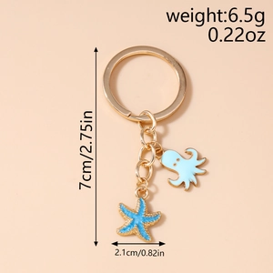 Detail view of octopus and starfish keychain with measurements showing 7cm length and 6.5g weight