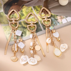 Ocean theme keychain with gold charms, white pearls and sea shells for bags