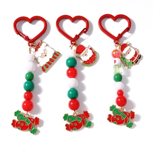 Christmas beaded keychains with Santa Claus and candy pendants on red heart clips