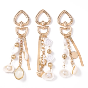 Bohemian ocean theme keychain with heart clasp, natural conch, and pearls in gold finish