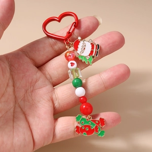 Detail of Christmas Santa and candy beaded keychain with red heart carabiner