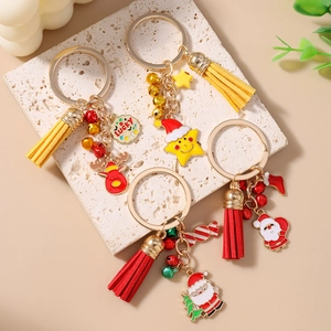 Chic Christmas keychains featuring Santa Claus, reindeer, and colorful leather tassels