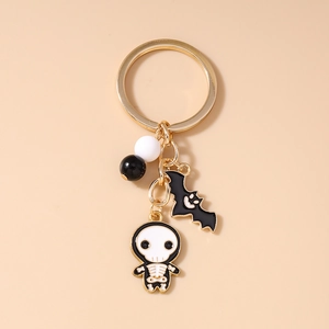 Detail of Halloween keychain with skull, bat pendant and gold-plated alloy ring charm