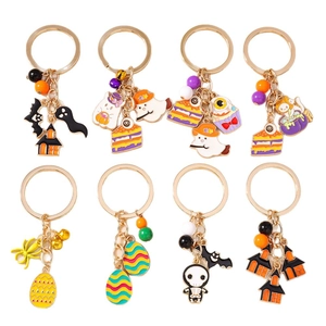 Set of 8 Halloween keychains featuring bats, ghosts, and castles with metal enamel charms