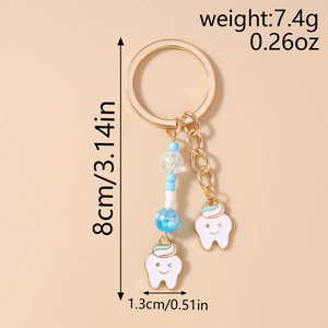 Detail of beaded keychain showing the 8cm length and cartoon tooth pendant charms