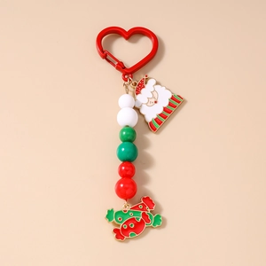 Detailed view of Christmas keychain with Santa charm and red white green beads