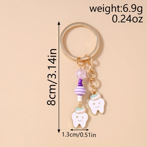 Detail view of cute tooth charms with purple beads and dimensions for bag pendant keychain