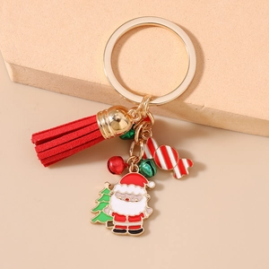 Detail of Christmas keychain with Santa charm, red tassel, and colorful festive bells