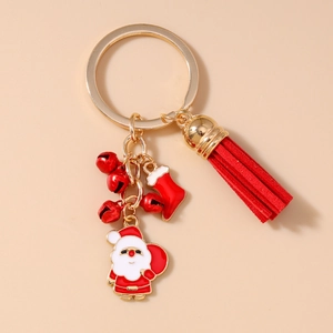 Detail of Christmas keychain with Santa Claus pendant, red tassel and golden bells