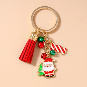 Detail of Christmas keychain with Santa, tree charms and a vibrant red tassel fringe