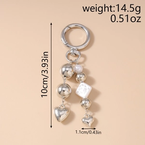 Detail of silver heart keychain with pearls showing dimensions 10cm and weight 14.5g
