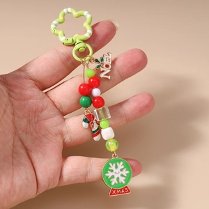 Christmas beaded keychain with NOEL letters, snowflake globe and candy cane pendants
