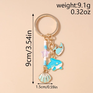 Detailed size and weight specs of the marine shark and shell enamel keychain