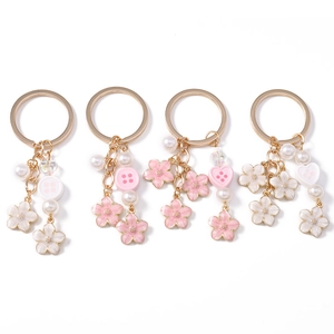 Sweet cherry blossom keychain set with pink sakura charms and white imitation pearls