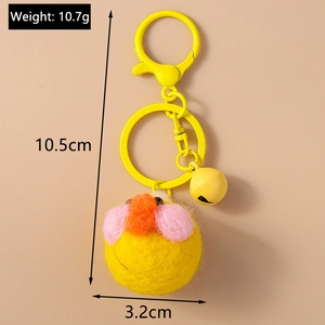 Detail view of yellow plush duck keychain with dimensions 10.5cm and bell accessory