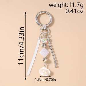 Detail view of heart bead keychain with rhinestone chain and seashell pendant dimensions