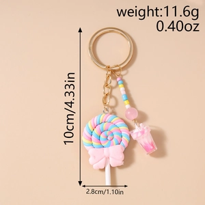 Detailed view of sweet lollipop keychain with pink bow and colorful beaded tassel charm