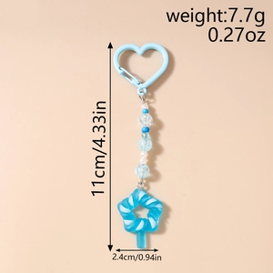 Detail view of light blue beaded keychain with star charm and heart clasp, 11cm length
