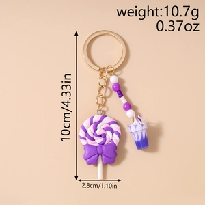 Detail view of lollipop keychain with purple bow and milk tea charm, size 10cm