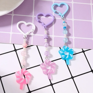 Colorful beaded keychain with star and lollipop pendants in pink blue and purple colors