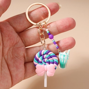 Detail of colorful lollipop keychain with beaded charms and pink bow accessory
