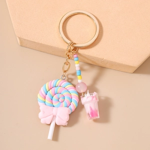 Lollipop and macaron bead keychain with pink drink charm on a golden keyring