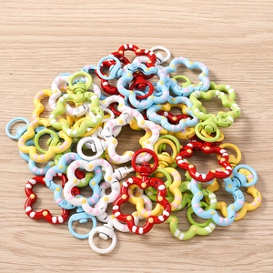 Macro detail of colorful floral lobster clasps with polka dot and stripe patterns