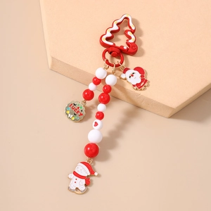 Detail of Christmas beaded keychain featuring Santa Claus, snowman, and Lucky round tag