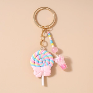 Detailed macro view of lollipop pendant with pink bow and colorful macaron beads
