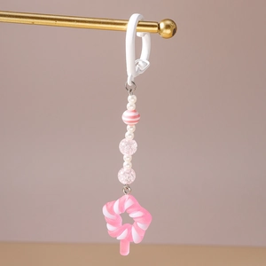 Detail of pink candy pendant with beads and white imitation pearls for bag charms