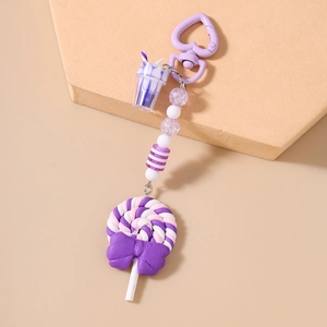 Detail of purple lollipop keychain with polymer clay beads and mini drink pendant charm