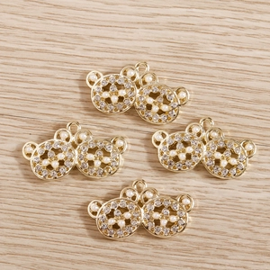 Set of four gold-tone bear pendants with sparkling rhinestones and elegant pearls