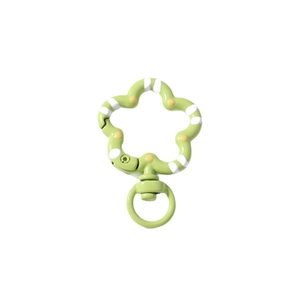Green flower-shaped lobster clasp with white stripes and yellow dots for keychains