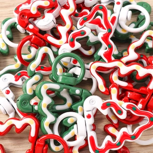 Detailed view of colorful Christmas tree shaped alloy lobster clasps for DIY keychains