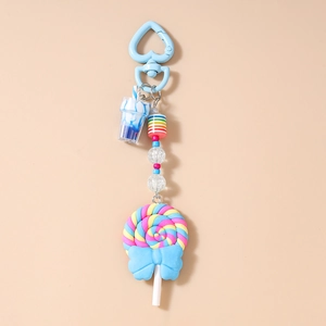 Detail of sweet lollipop keychain featuring blue heart clasp and striped beads