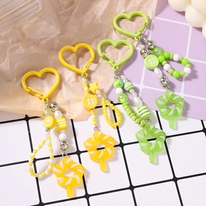 Portachiavi con perline colorate a lecca-lecca con fibbie a cuore e ciondoli limone