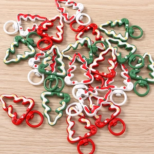 Detail of Christmas tree shaped alloy lobster clasps with colorful enamel finish
