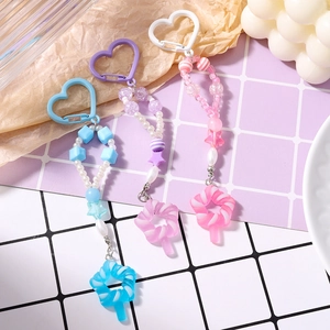 Bunte Perlen-Schlüsselanhänger mit Stern und Lutscher in Rosa Blau und Lila