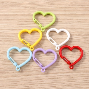Set of six colorful heart-shaped spring snap hooks for DIY keychains and bags