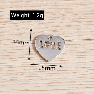 Detail view showing a 15mm silver heart charm with LOVE cutout and 1.2g weight specs