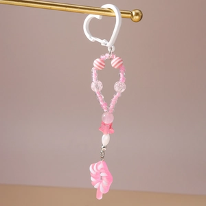 Detail der rosa-weißen Perlen-Schlüsselanhänger mit Sternen und Lollipop-Anhänger