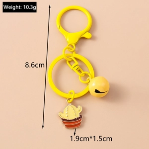 Detailed view of yellow bell and enamel cactus pendant keychain with dimensions and weight