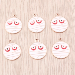 Pendentifs œil de momie en émail blanc sur fond bois pour la création de bijoux