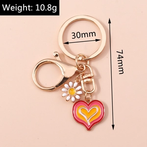 Detailed size view of heart and daisy keychain showing 74mm length and 30mm ring width