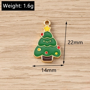 Detailed view of green enamel Christmas tree charm with size 22x14mm and weight 1.6g