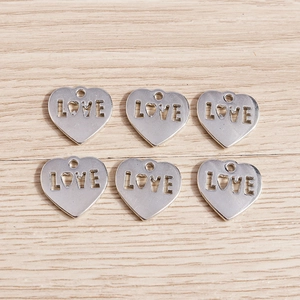 Silver hollow heart-shaped LOVE charms for DIY jewelry making and necklace pendants